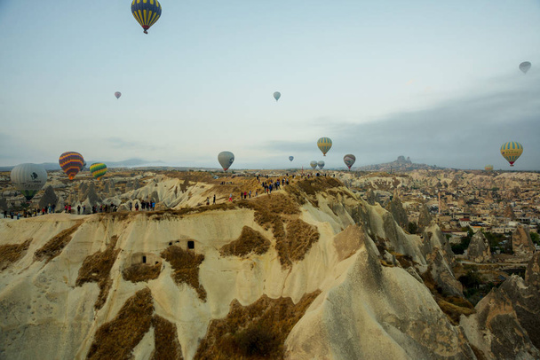The great tourist attraction of Cappadocia - balloon flight. Cappadocia is known around the world as one of the best places to fly with hot air balloons. Goreme, Cappadocia, Turkey. - Foto, afbeelding