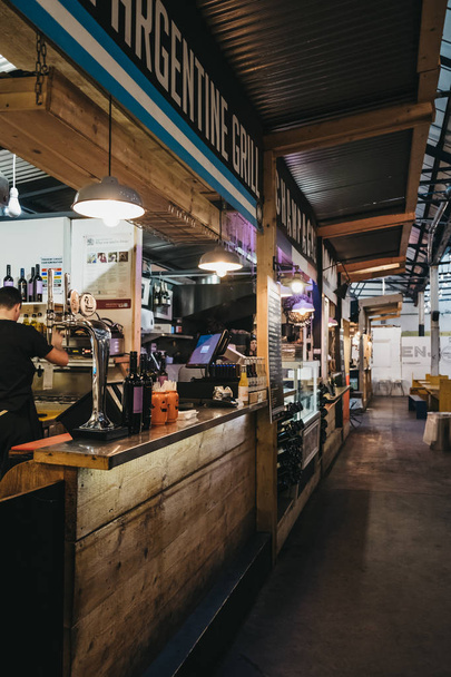 London, UK - November 2, 2018: Food and drink stands inside Mercato Metropolitano, the first sustainable community market in London focused on revitalising the area and protecting environment. - Photo, Image