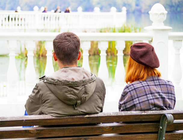 couple in love on a bench by the river - Photo, Image