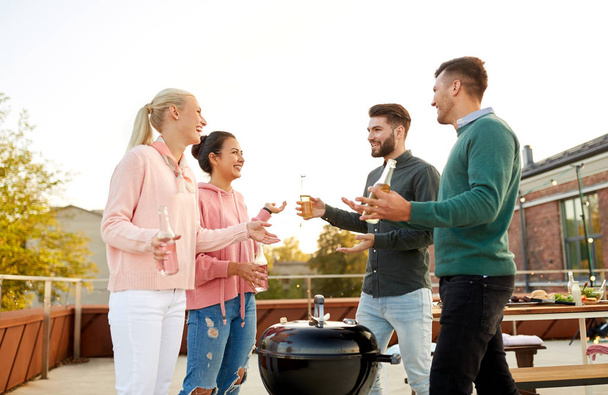happy friends having bbq party on rooftop - Photo, image
