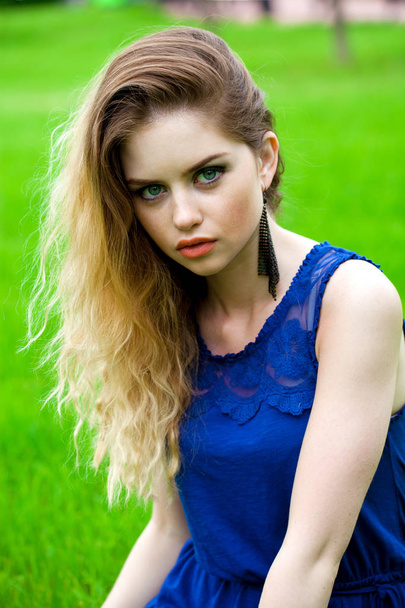 Close up Portrait, Young beautiful blonde woman posing outdoors in summer green park - Photo, Image
