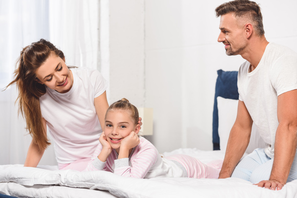 happy family spending time together in bed in morning - Photo, image