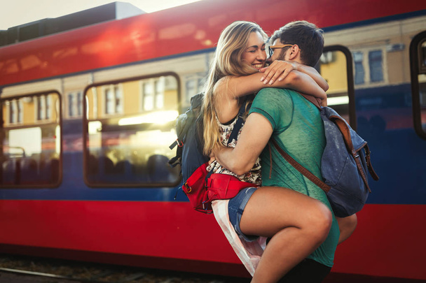 Beautiful couple reunion separation at train station - Fotografie, Obrázek