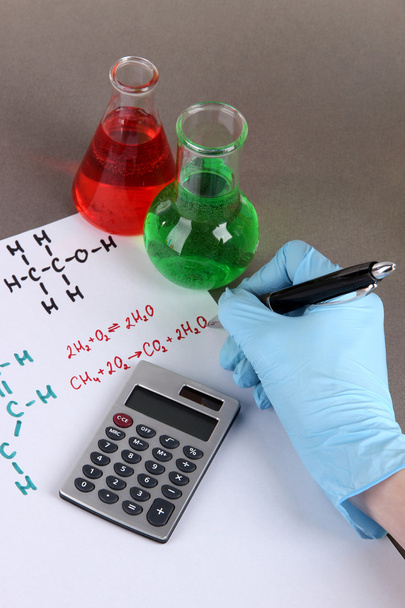 Hand scientist writing formulas - Zdjęcie, obraz