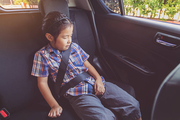 happy little girl wearing seatbelts in car - Foto, immagini