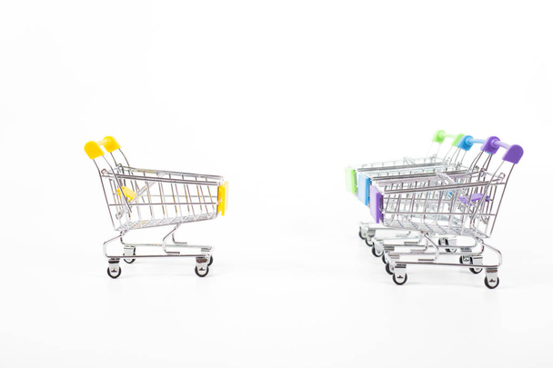 Colorful shopping carts on white background - Photo, Image