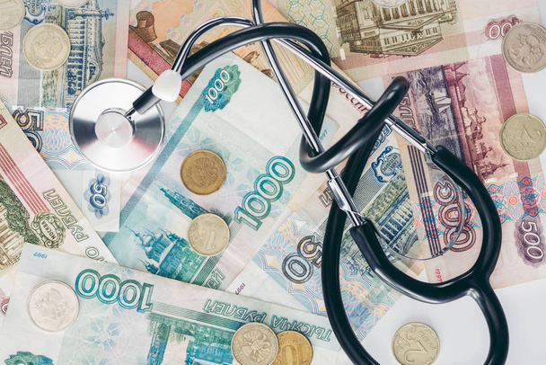 top view of russian rubles and stethoscope on surface - Zdjęcie, obraz