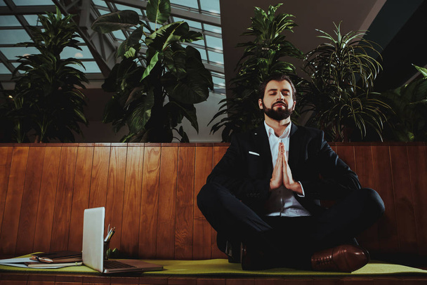 Sport Lifestyle. Healthcare of Business People.Yoga Practice. Employee Practicing on Bench in Office. Worker Sit in Lotus Pose. Man is Meditating. Person Relax. Male Keeps Calm. Zen Time. - Foto, immagini