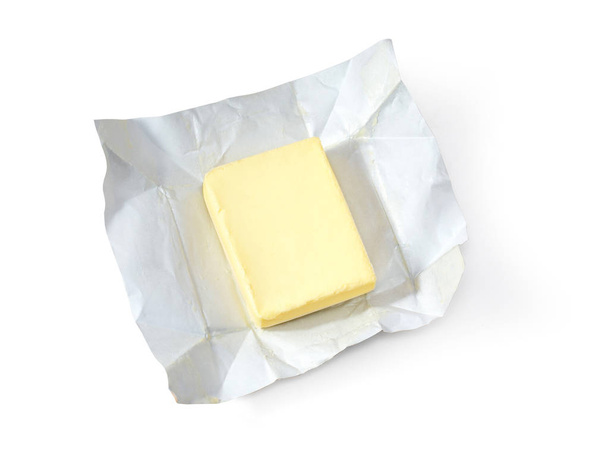 Pièce de beurre isolée sur fond blanc, vue de dessus, avec chemin de coupe
 - Photo, image