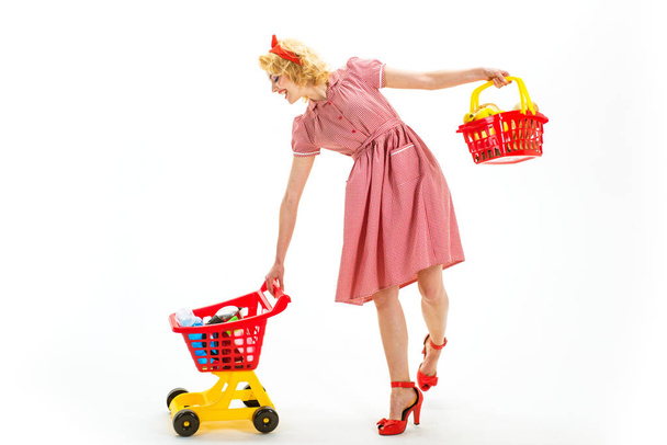 This is for you. Open. happy retro woman go shopping. Going for shopping. shopping marketing and commercial business concept. concumerism. vintage woman is real shopaholic. retro girl with full cart. - Zdjęcie, obraz