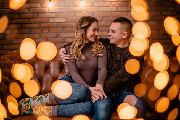 portrait of couple among festive lights - Foto, Imagen