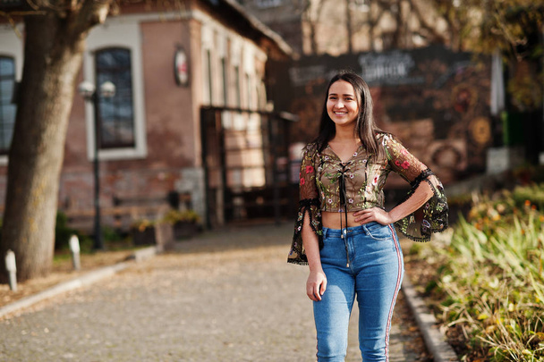Pretty latino model girl from Ecuador wear on jeans posed at street.  - Zdjęcie, obraz