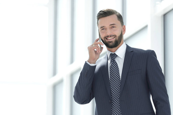close up.smiling businessman talking on the phone - Photo, image