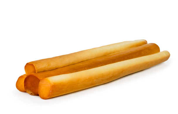 Sticks of smoked cheese closeup on a white background. Isolated. - Photo, Image