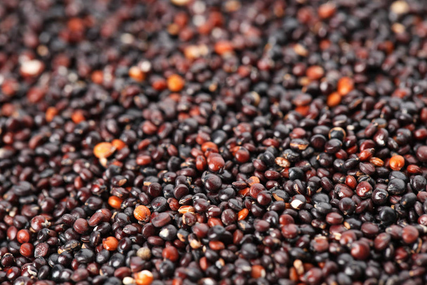 Raw black quinoa seeds as background, closeup - Valokuva, kuva