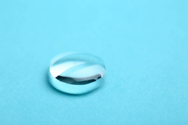 Pure water drop on color background, closeup. Space for text - Fotoğraf, Görsel