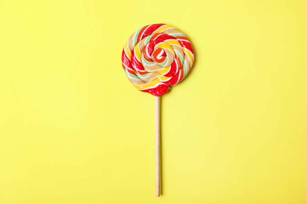 Tasty colorful fruit flavored candy on color background, top view - Φωτογραφία, εικόνα