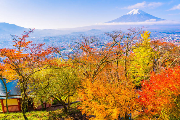 Beautiful landscape of mountain fuji around maple leaf tree with white cloud and blue sky in autumn season at Yamanashi Japan - Photo, Image