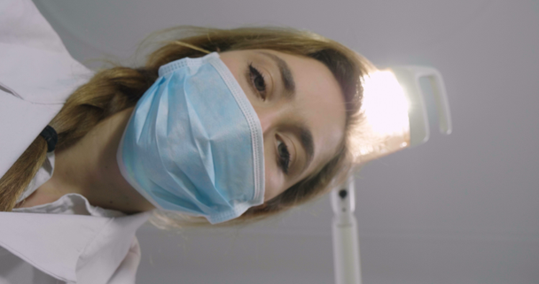 slow motion video of dentist doctor woman in mask working with surgeon - Materiał filmowy, wideo