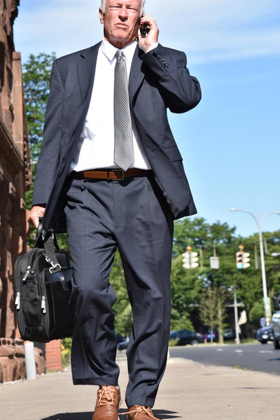 Entrepreneur Using Cell Phone Wearing Suit And Tie Walking - Фото, изображение
