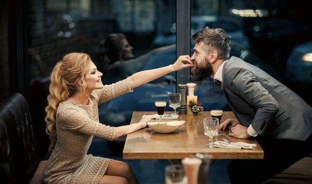 restaurant date of young couple. sexy couple eating in restaurant. - Foto, immagini