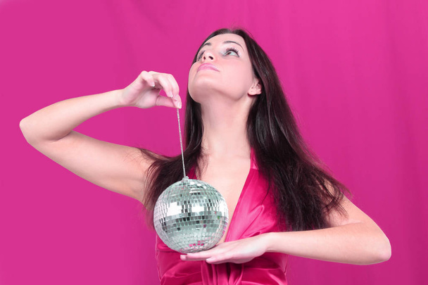 stylish young woman with a mirror ball - Фото, изображение