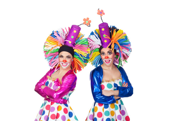 Couple of funny clowns with big colorful wigs - Photo, Image