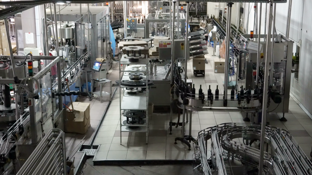 Bottling and sealing conveyor line at winery factory - Footage, Video