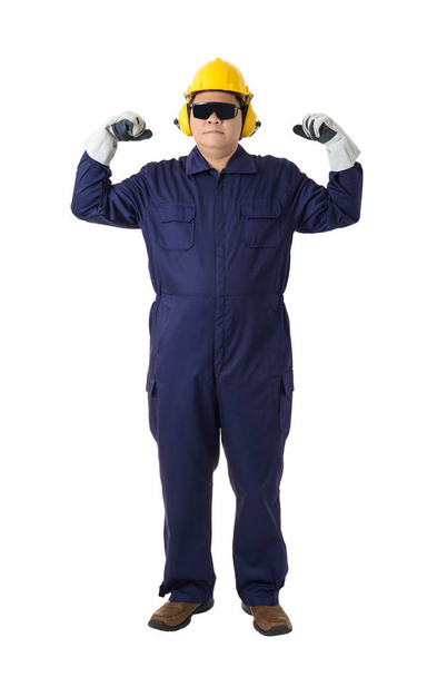 Full body portrait of a worker in Mechanic Jumpsuit with helmet, earmuffs, Protective gloves and Safety goggles isolated on white background clipping path - Photo, Image