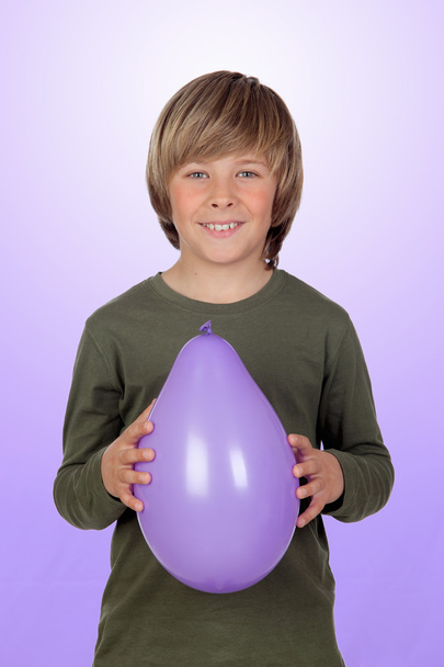 Adorable preteen boy with a purple balloon - Photo, Image