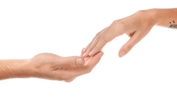 Mężczyzna i Kobieta, dotykając palcami na białym tle - Zdjęcie, obraz