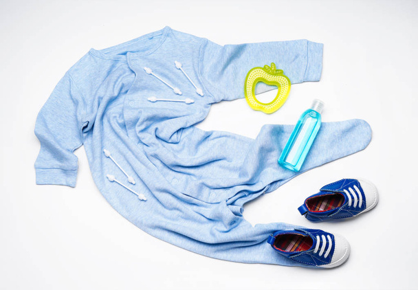 Composition with clothes and baby care accessories on white background - Photo, Image
