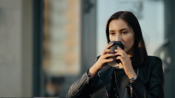 Young attractive woman drinking coffee. - Video, Çekim