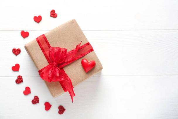 Beautiful gift with hearts on white table. Valentines Day celebration - Zdjęcie, obraz