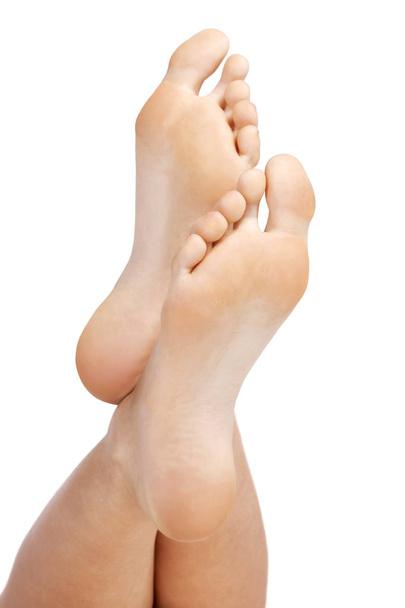 Closeup shot of female feet, isolated on white background - Photo, Image