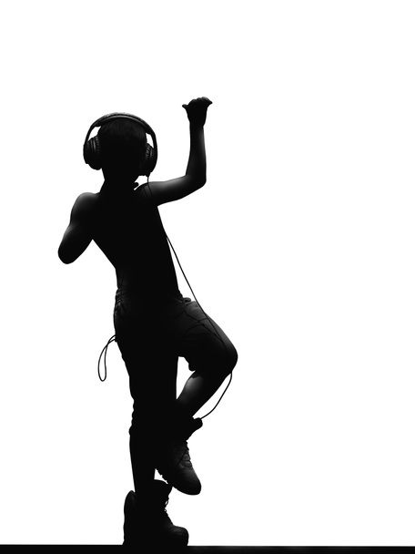 силуетна фігура підлітка в навушниках, що танцює на музику. Ізольовані на білому тлі
 - Фото, зображення