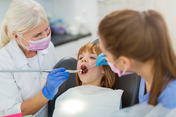 Young girl have a checkup at the dentist - Фото, зображення