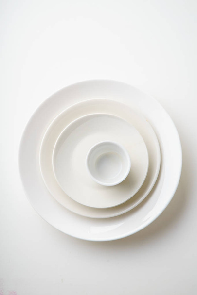 set of porcelain dishes isolated on white background, close-up  - Photo, image