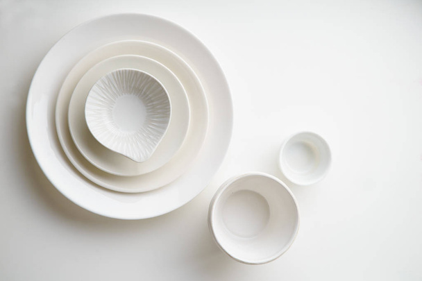 collection of porcelain plates isolated on white background, close-up  - Valokuva, kuva