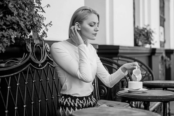 Peaceful coffee break. Woman elegant calm face have drink cafe terrace outdoors. Mug of good coffee in morning gives me energy charge. Girl drink coffee every morning at same place as tradition - Фото, зображення