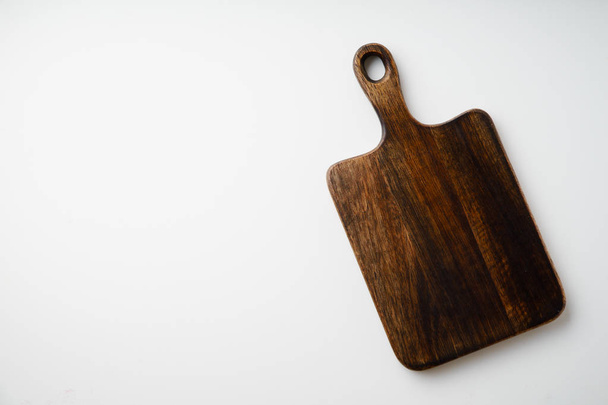 Cutting board made of wood isolated on white background, close-up  - Fotó, kép