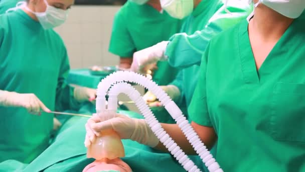Surgical team performing in operating theater - Footage, Video