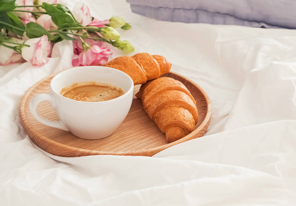 Breakfast in bed with coffee and croissants - Фото, изображение