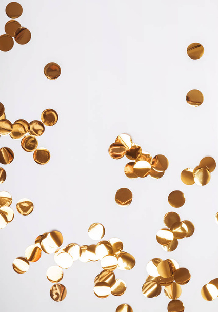 Golden glitter decor circles on the white background - Foto, Bild