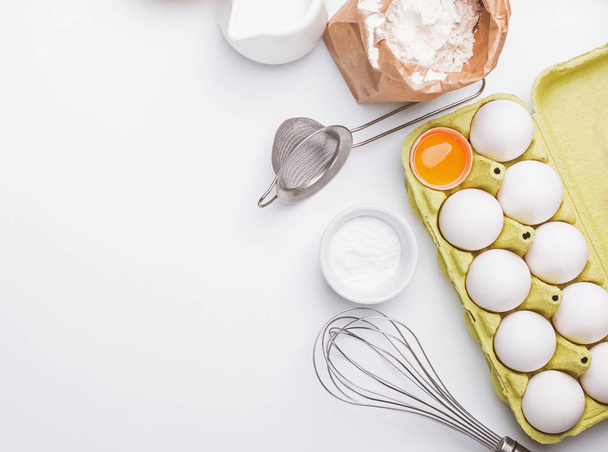 Tools and ingredients for baking: flour, eggs, milk and other. - Fotó, kép
