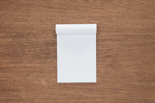 top view of blank notebook on wooden background - Photo, Image