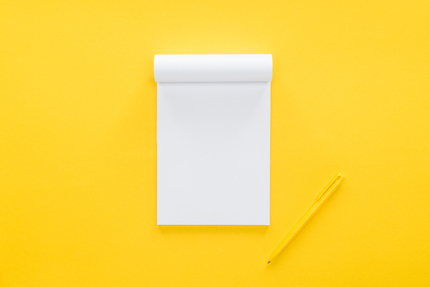 top view of blank notebook on yellow background - Photo, Image