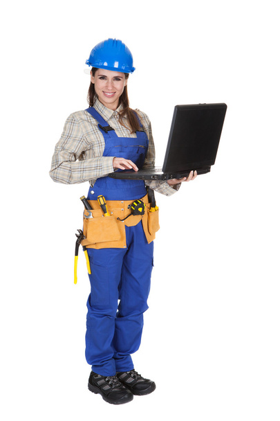 Female Worker Working On Laptop - Фото, изображение