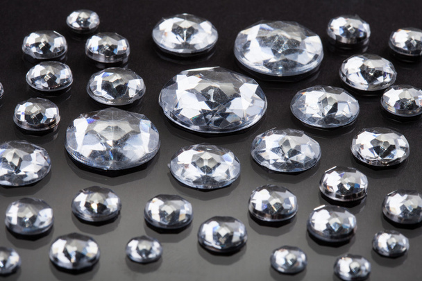Close-up Of Diamonds Isolated Over Gray Background - Foto, afbeelding