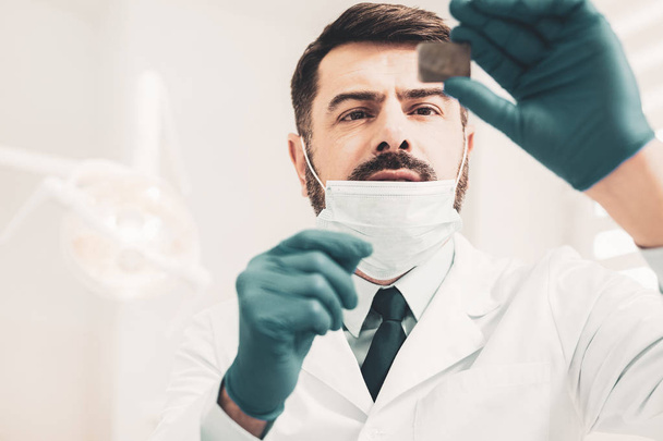 Doctor looking at dental radiography - Fotó, kép